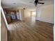 Open-concept kitchen and living area featuring modern appliances, wood laminate flooring and abundant natural light at 3118 Honeysuckle Ave, North Las Vegas, NV 89031