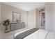 Neutral bedroom showcases a large window, grey dresser, comfortable carpet, a decorative plant, and modern decor at 350 Robledo St, Las Vegas, NV 89138