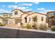 Charming home features a well-manicured front yard and attached two-car garage at 350 Robledo St, Las Vegas, NV 89138