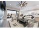 Bright living room featuring a fireplace, balcony access, and open layout to the kitchen at 350 Robledo St, Las Vegas, NV 89138