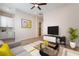 Inviting living room featuring modern decor, hardwood floors, and a seamless flow to the kitchen area at 350 Robledo St, Las Vegas, NV 89138