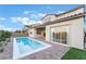 Backyard boasts a sleek rectangular pool and covered patio, perfect for entertaining at 350 Robledo St, Las Vegas, NV 89138