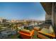 Relaxing balcony with comfortable seating and panoramic views of the city skyline at dusk at 353 E Bonneville Ave # 1407, Las Vegas, NV 89101