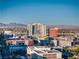 City view overlooking buildings on a sunny day with mountains in the background at 353 E Bonneville Ave # 1407, Las Vegas, NV 89101