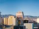 City view featuring casinos and hotels with the mountains in the background on a sunny day at 353 E Bonneville Ave # 1407, Las Vegas, NV 89101