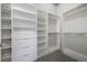 Walk-in closet featuring custom shelves and drawers at 353 E Bonneville Ave # 1407, Las Vegas, NV 89101