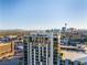 Exterior shot of condominium building with beautiful city views and the Stratosphere in the distance at 353 E Bonneville Ave # 1407, Las Vegas, NV 89101