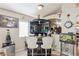 Cozy bar area with unique decor, seating, and a view into the kitchen at 3805 Sorrowing Sparrow Ct, North Las Vegas, NV 89032