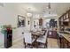 Kitchen with dining table, dark cabinets, granite counters, and stainless appliances at 3805 Sorrowing Sparrow Ct, North Las Vegas, NV 89032