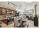 Eat-in kitchen with dark wood cabinets, granite countertops, and stainless steel appliances at 3805 Sorrowing Sparrow Ct, North Las Vegas, NV 89032