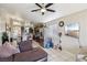 Bright open-plan living area featuring a kitchen and dining area with modern stainless steel appliances at 3805 Sorrowing Sparrow Ct, North Las Vegas, NV 89032