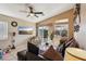 Comfortable living room offering tile floors, backyard access, and a modern ceiling fan at 3805 Sorrowing Sparrow Ct, North Las Vegas, NV 89032