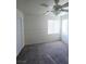 Bedroom featuring carpet, a ceiling fan, and a window, creating a cozy and comfortable atmosphere at 4039 Meadow Foxtail Dr, Las Vegas, NV 89122