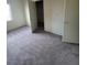 Bedroom featuring neutral carpet and two doors at 4039 Meadow Foxtail Dr, Las Vegas, NV 89122