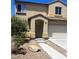 Two-story home showcasing a well-kept lawn and inviting entryway at 4039 Meadow Foxtail Dr, Las Vegas, NV 89122