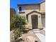 Front view of a two-story home with a two-car garage and desert landscaping at 4039 Meadow Foxtail Dr, Las Vegas, NV 89122