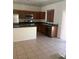 A spacious kitchen featuring stainless steel appliances and a breakfast bar at 4039 Meadow Foxtail Dr, Las Vegas, NV 89122