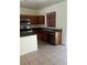 This kitchen includes a kitchen island, double sinks, and stainless steel appliances at 4039 Meadow Foxtail Dr, Las Vegas, NV 89122