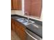 This kitchen features stainless steel appliances, double sinks, and wood cabinets at 4039 Meadow Foxtail Dr, Las Vegas, NV 89122