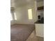 This living room includes natural lighting and a carpet floor at 4039 Meadow Foxtail Dr, Las Vegas, NV 89122