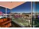 Balcony seating area and evening skyline view at 4525 Dean Martin Dr # 1500, Las Vegas, NV 89103