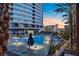 Rooftop pool and lounge area with city views at dusk, featuring modern design at 4525 Dean Martin Dr # 1500, Las Vegas, NV 89103