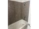 Bathroom features a tub-shower combination with solid-surface walls at 4965 Indian River Dr # 101, Las Vegas, NV 89103