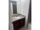 Bathroom with vanity, granite countertop, and mirror, with shower over tub at 4965 Indian River Dr # 101, Las Vegas, NV 89103