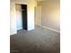 Spacious bedroom with closet, gray carpet, and neutral color scheme at 4965 Indian River Dr # 101, Las Vegas, NV 89103