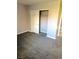 Bedroom with gray carpet, closet, and painted walls, offering a serene space at 4965 Indian River Dr # 101, Las Vegas, NV 89103