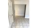 Hallway featuring tile floors and neutral paint, leading to other rooms at 4965 Indian River Dr # 101, Las Vegas, NV 89103