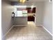 Cozy dining space adjacent to the kitchen, featuring tile floors and neutral walls at 4965 Indian River Dr # 101, Las Vegas, NV 89103