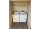 Laundry area with washer, dryer, and a shelf at 4965 Indian River Dr # 101, Las Vegas, NV 89103