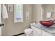 Cozy bathroom featuring a granite countertop, vessel sink, and plantation shutters for natural light at 5049 Forest Oaks Dr, Las Vegas, NV 89149