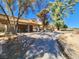 Community area featuring a covered pavilion, a paved pathway, mature trees, and desert landscaping at 5049 Forest Oaks Dr, Las Vegas, NV 89149