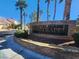 Stone community sign reading 'Portraits' surrounded by palm trees and landscaped greenery at 5049 Forest Oaks Dr, Las Vegas, NV 89149