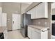 Spacious kitchen featuring stainless steel appliances and neutral countertops at 5049 Forest Oaks Dr, Las Vegas, NV 89149