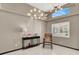 Staged living room features decorative lighting, tile floors, and a console table with decorations at 5049 Forest Oaks Dr, Las Vegas, NV 89149