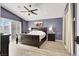 Spacious main bedroom with a ceiling fan and ample natural light from a large window at 5049 Forest Oaks Dr, Las Vegas, NV 89149