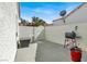 Private outdoor patio area featuring a grill, seating, and decorative plants at 5049 Forest Oaks Dr, Las Vegas, NV 89149