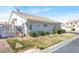 Lovely home showcasing a side entrance and well-placed landscaping at 5049 Forest Oaks Dr, Las Vegas, NV 89149