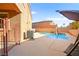 A backyard with a pool, patio seating, desert landscape, and privacy walls at 505 Los Dolces St, Las Vegas, NV 89138