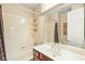 Bathroom with a vanity, mirror, and shower-tub combination at 505 Los Dolces St, Las Vegas, NV 89138