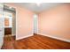 Empty bedroom features hardwood floors, multiple doors, and neutral paint at 505 Los Dolces St, Las Vegas, NV 89138