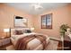 A staged bedroom showcases hardwood floors, a ceiling fan, and natural lighting at 505 Los Dolces St, Las Vegas, NV 89138