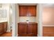 Hallway featuring wood cabinets and views into the bathroom and bedroom at 505 Los Dolces St, Las Vegas, NV 89138