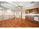 Upstairs living room featuring wood floors, a wet bar, and natural light at 505 Los Dolces St, Las Vegas, NV 89138