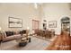 Bright, staged living room with high ceilings, hardwood floors, and elegant furniture at 505 Los Dolces St, Las Vegas, NV 89138