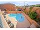 Backyard oasis with a sparkling pool and lush landscaping at 505 Los Dolces St, Las Vegas, NV 89138