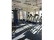 Community fitness center complete with treadmills, weight machines, and natural light at 5055 W Hacienda Ave # 1116, Las Vegas, NV 89118